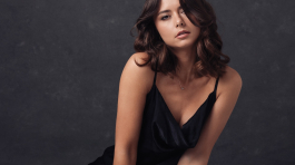 Elegant studio portrait of a woman in a black dress, highlighting the talent of affordable photographers in Ohio and photography studios in Columbus, Ohio for professional portraits.