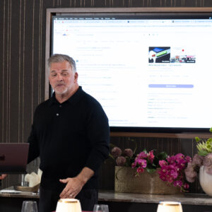 Business professional giving a presentation in a modern meeting room