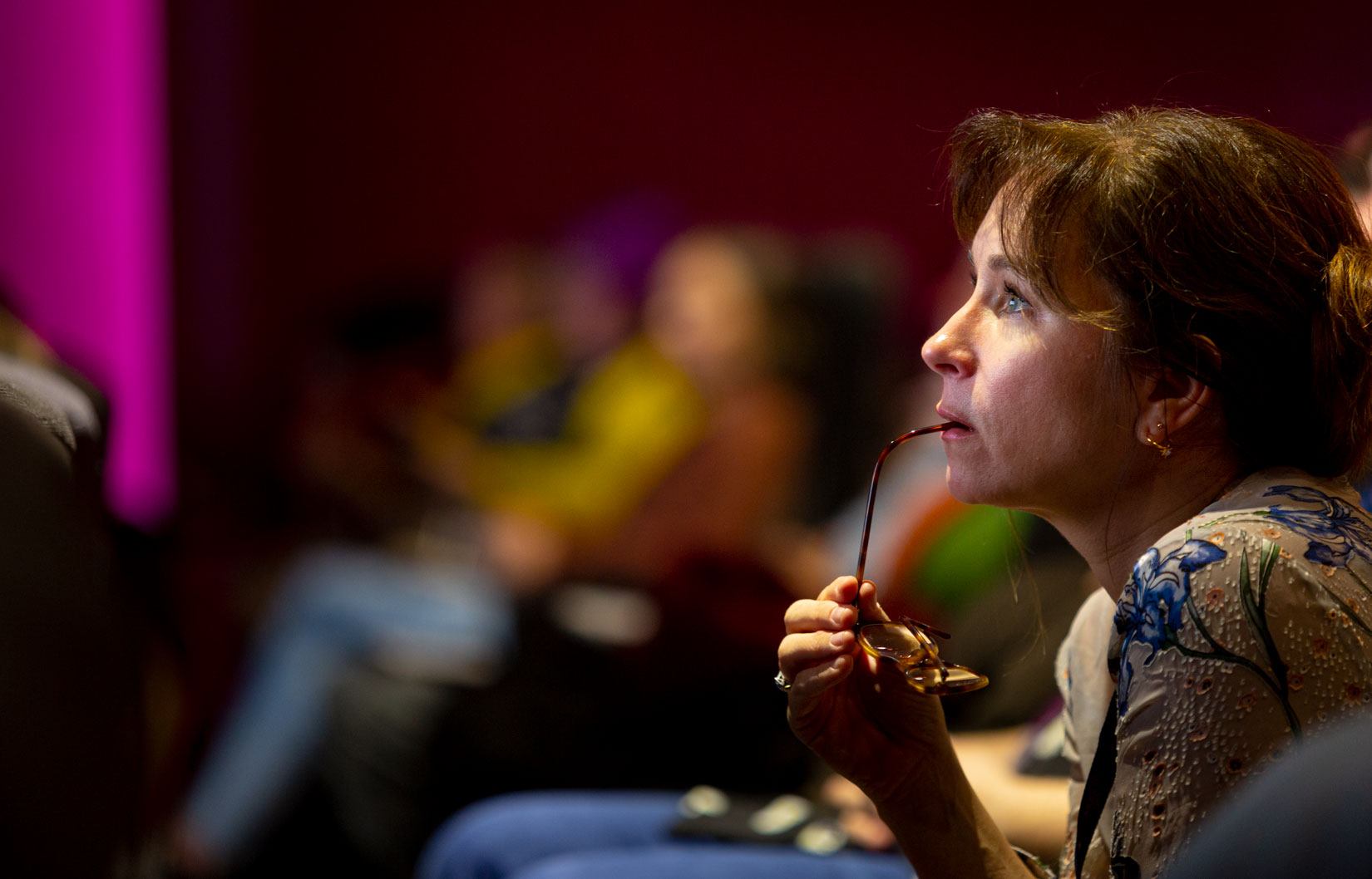 Candid corporate event photo highlighting engagement and focus