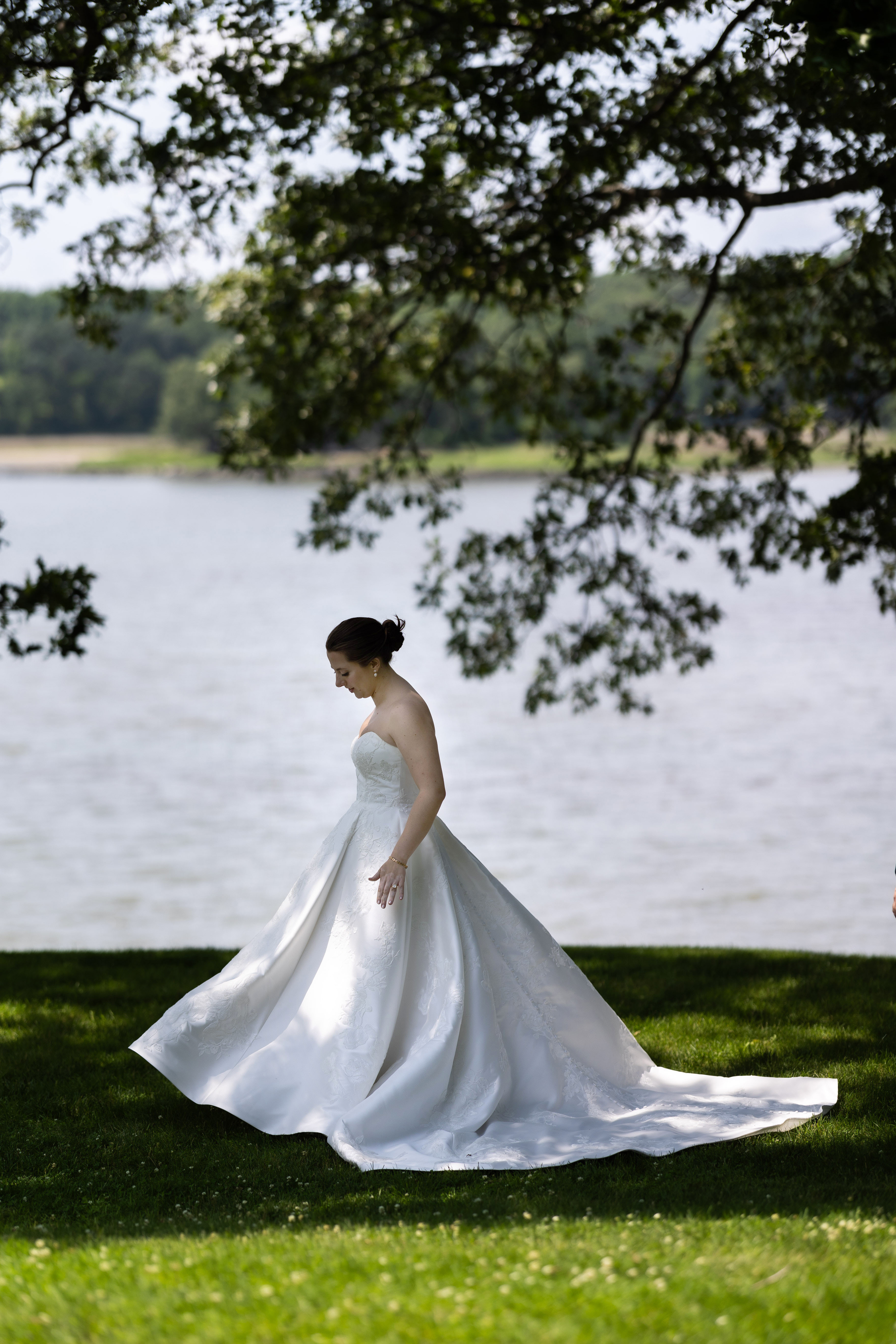 Bride standing gracefully by a lakeside, wedding photography and videography Hamilton Columbus Ohio